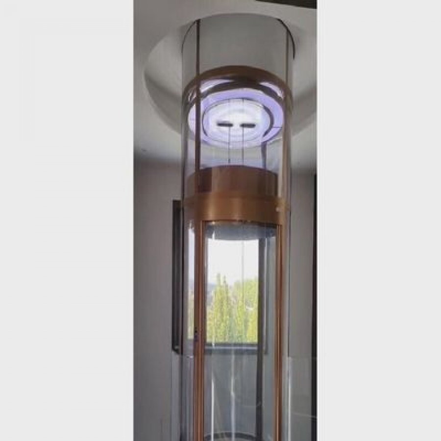 Elegant Circular Glass Elevator | High-Rise Residential Lift
